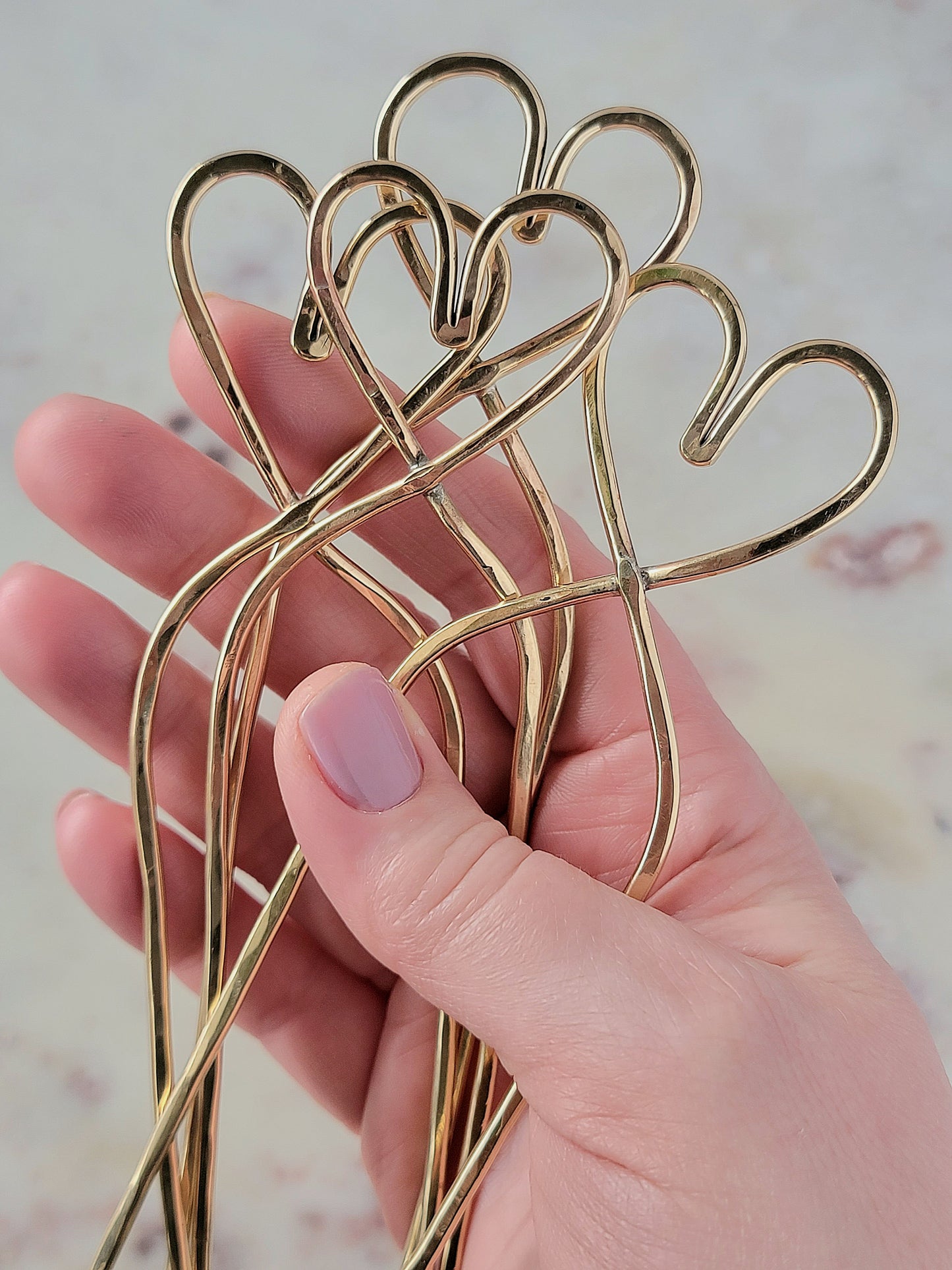 a grouping of love to wander brass hair forks